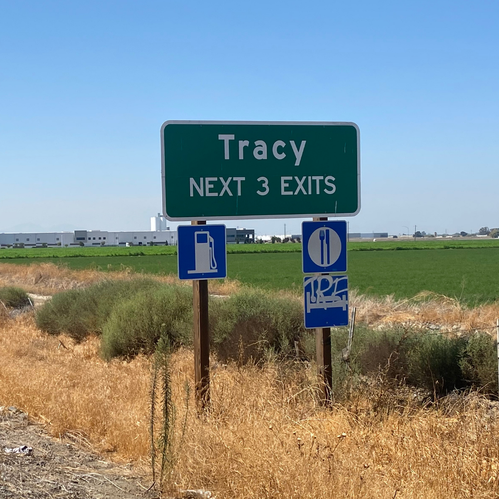 Tracy, CA freeway sign where Servant King services Junk Removal and demoltion